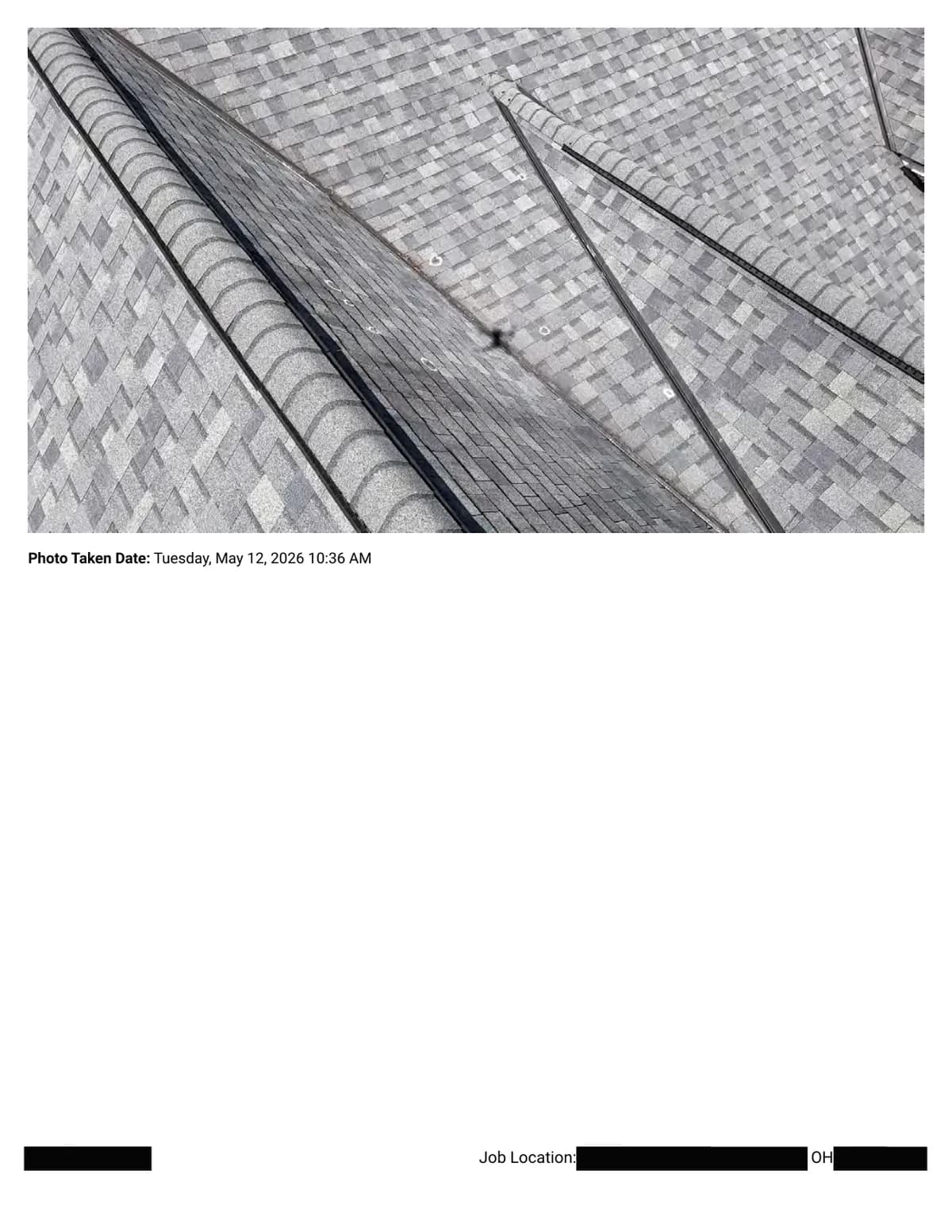 A metal-lined valley where several roof planes meet, with chalk circles marking impacts on the surrounding shingles.