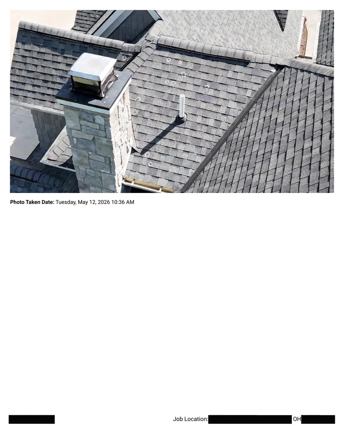 Roof planes around a stone chimney with a metal vent cap, with chalk circles marking hail impacts on the surrounding shingles.