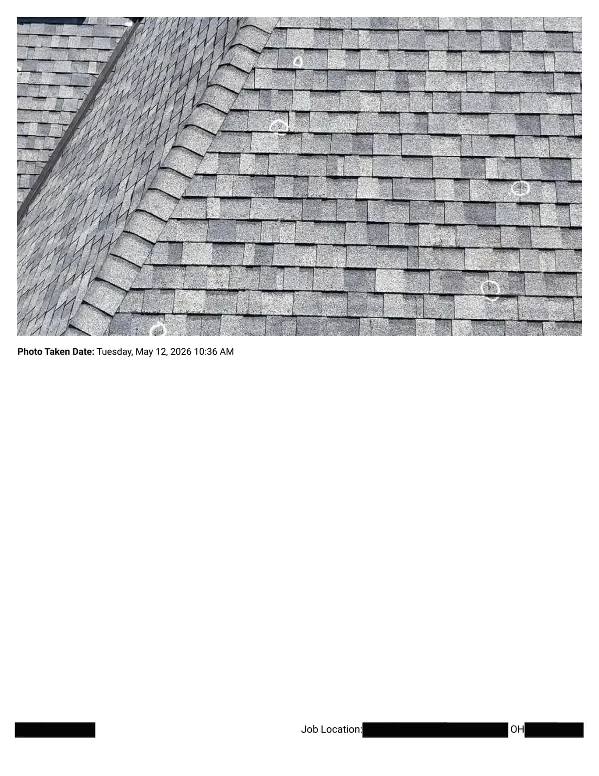 A shingle slope beside a ridge cap with scattered hail impacts circled in chalk.