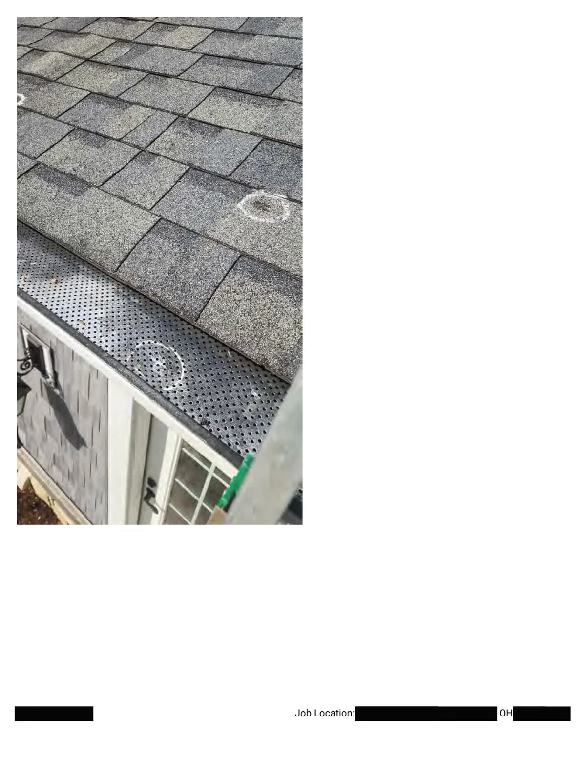 The eave from above: chalk circles on the shingles and on the perforated gutter guard, with a door and siding below.