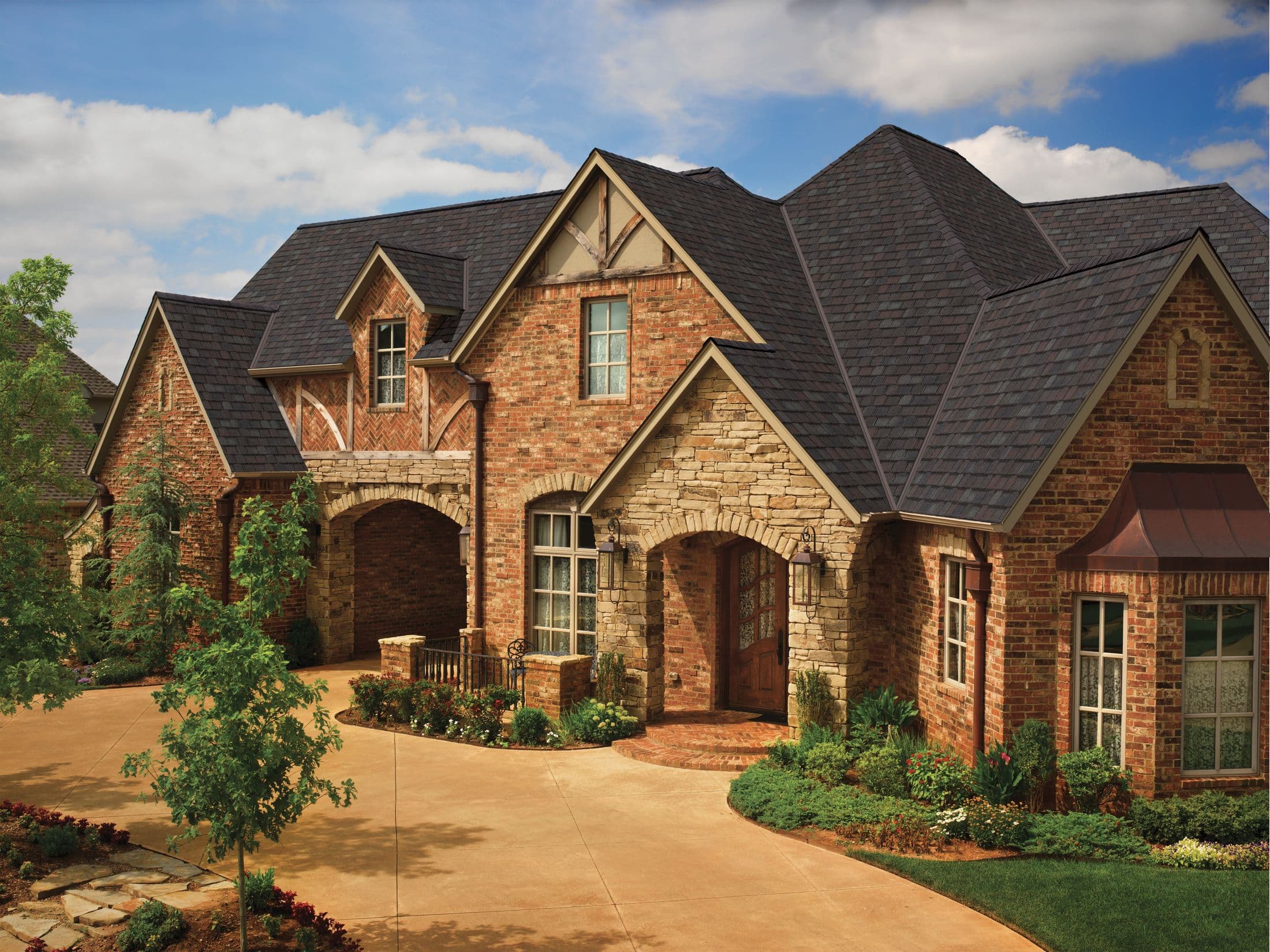 Home with designer laminated architectural shingles