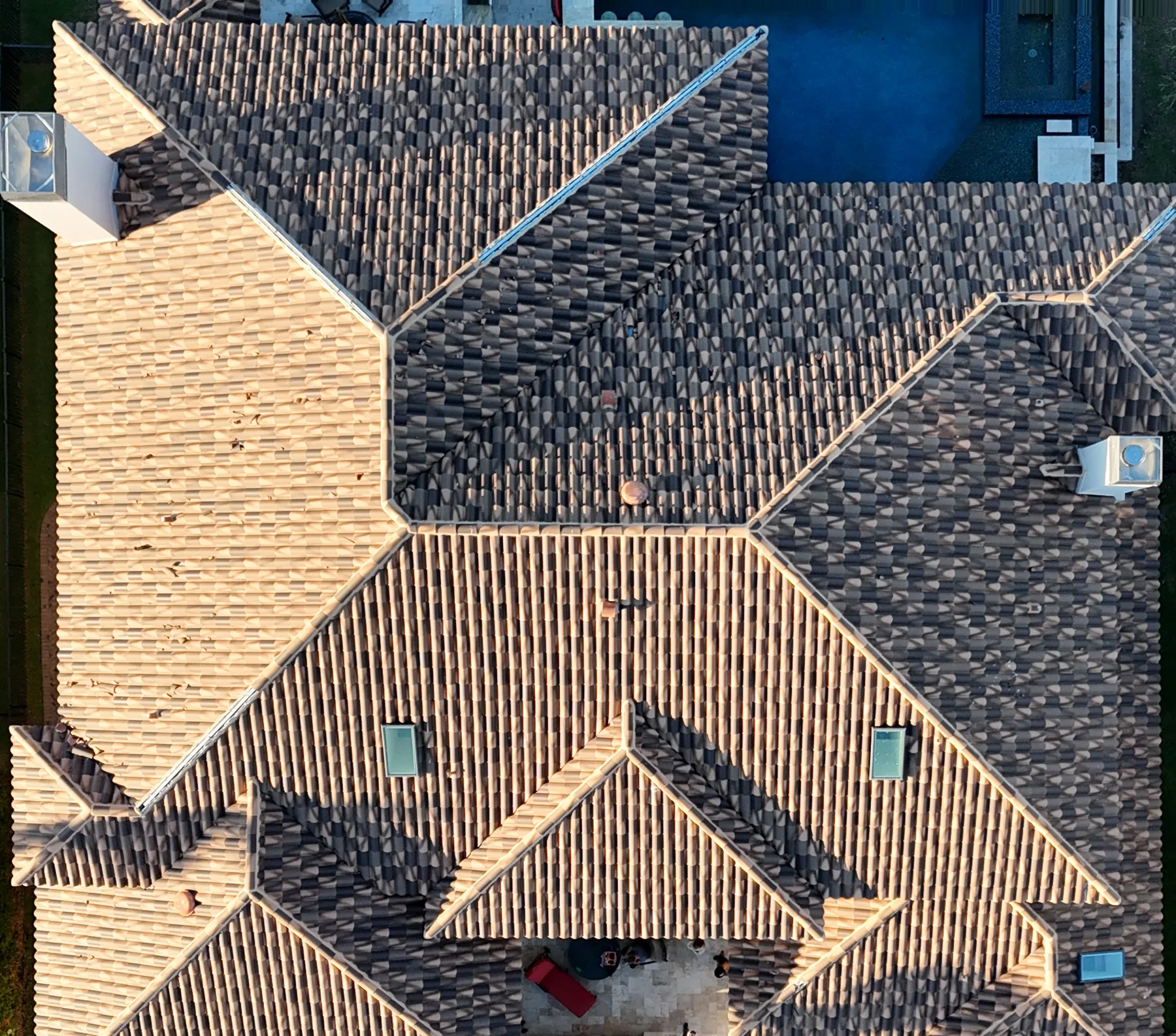 Overhead drone view of the aged clay tile roof before replacement, St. Petersburg