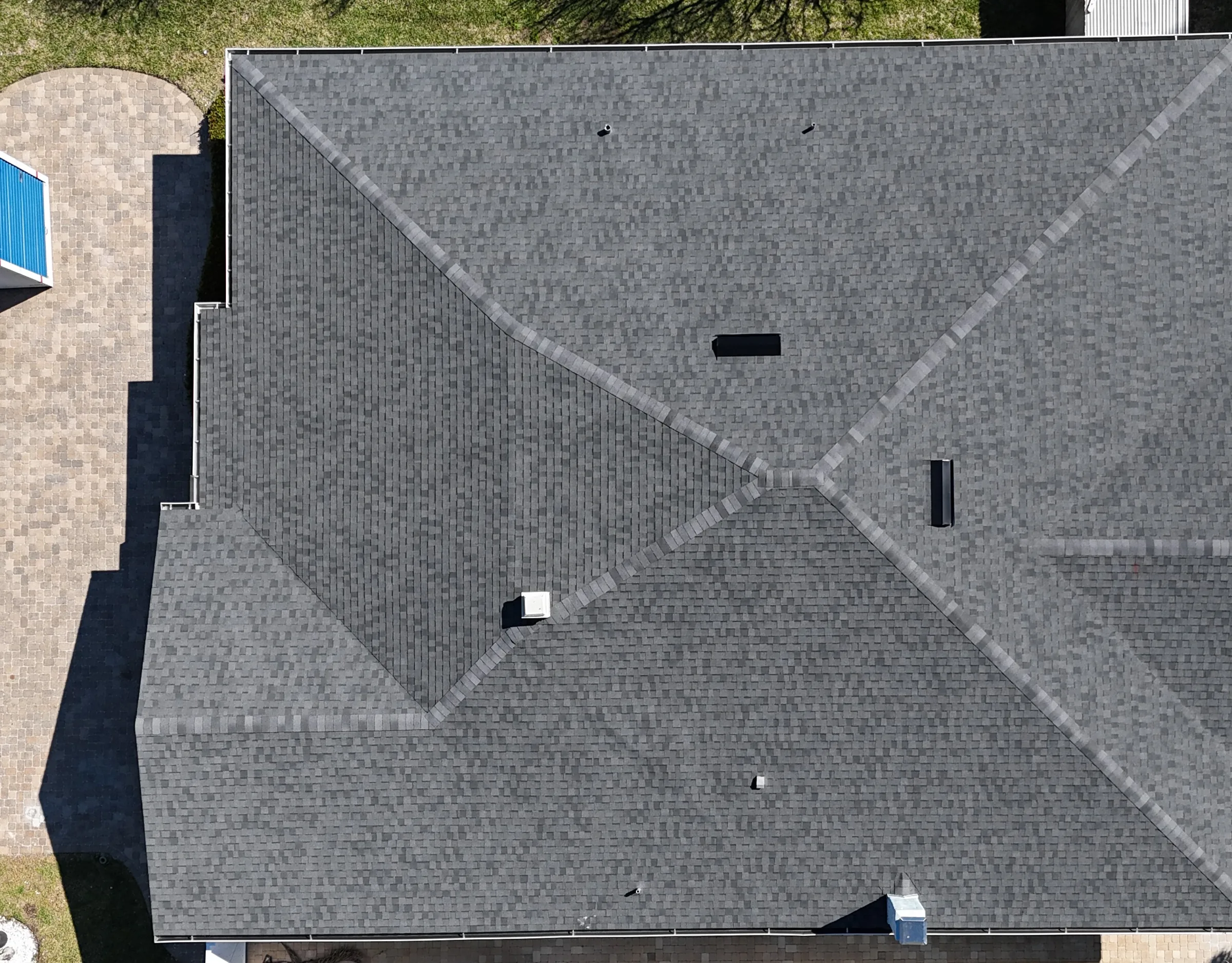 Overhead view of the completed gray architectural-shingle roof in Treasure Island